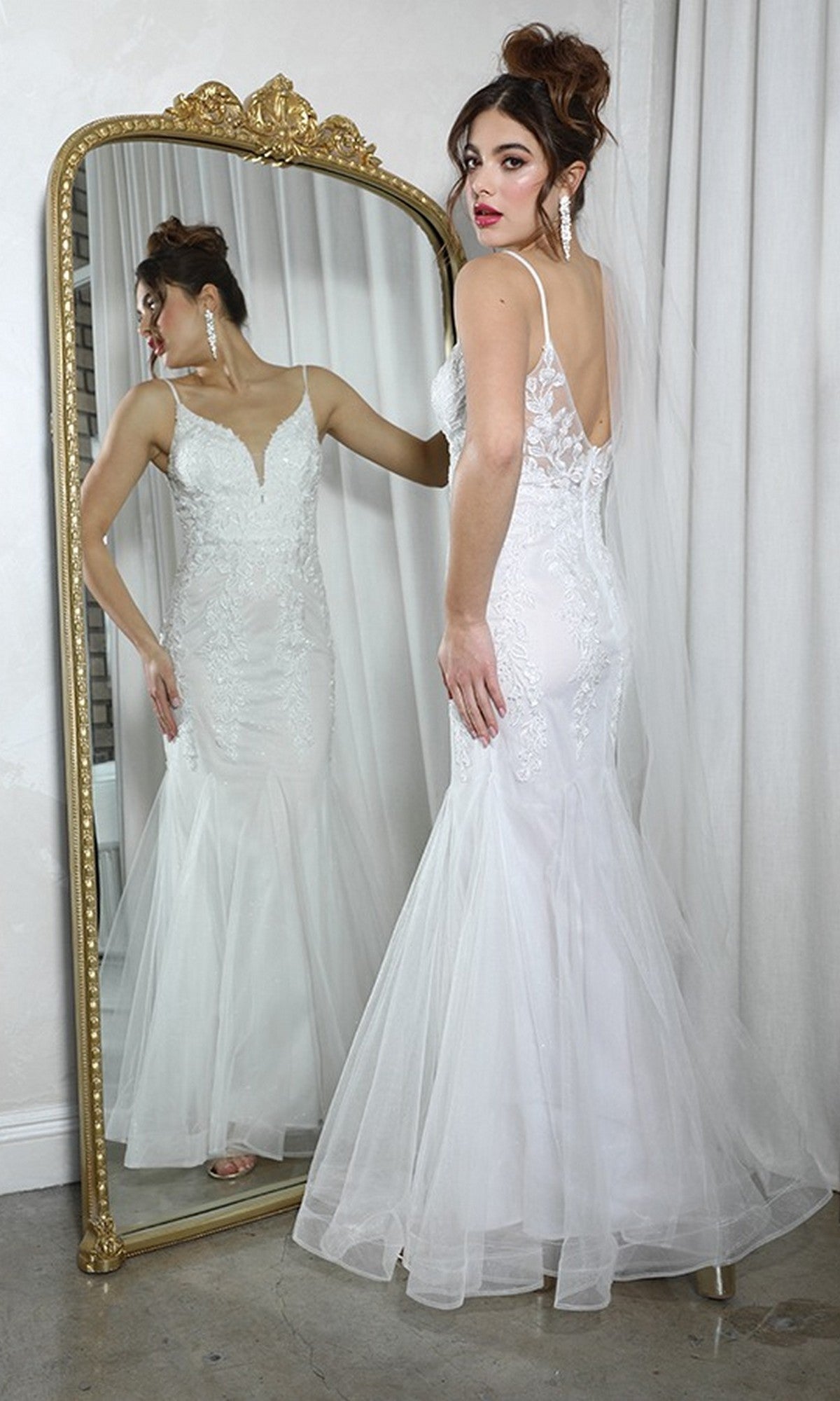 A woman wearing the Long Prom Dress: Eureka 9998 stands before a large ornate mirror, displaying both the front and back views of her elegant gown.